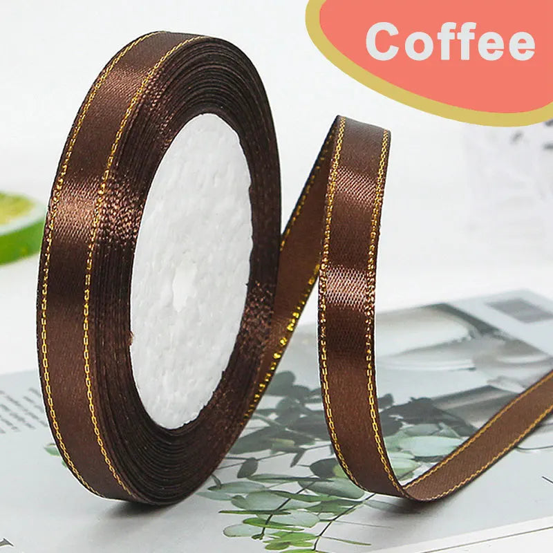 Roll of dark brown satin ribbon with gold edge for crafting or gift wrapping