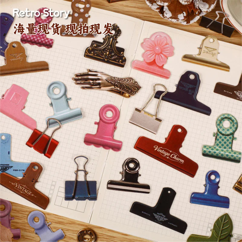 A collection of vintage metal clip themed stickers for journaling and scrapbooking displayed on a grid.