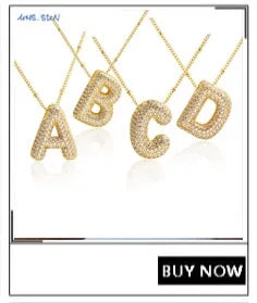 A set of gold-plated shell pearl beaded necklaces spelling out the letters A through D