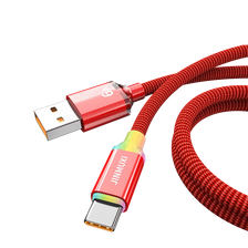 A red and gold USB-C fast charging cable with braided durability shown connected to a connector.