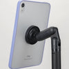 A light purple iPad is mounted on a black magnetic stand for viewing.