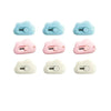 A set of four pastel colored portable rabbit cloud letter openers and crafting tools.