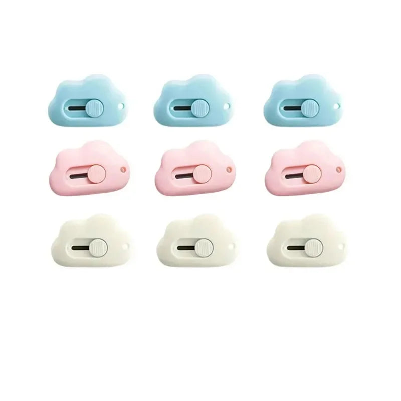 A set of four pastel colored portable rabbit cloud letter openers and crafting tools.
