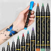 A hand holds a black face paint kit with ten tips, featuring various colors like orange, green, and purple.