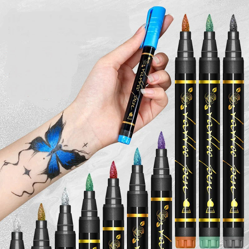 A hand holds a black face paint kit with ten tips, featuring various colors like orange, green, and purple.