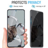 A hand holds a smartphone with a privacy tempered glass screen protector applied, demonstrating anti-spy features.
