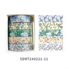 A set of five rolls of floral patterned washi tape in various shades of blue, green, and yellow for crafting.
