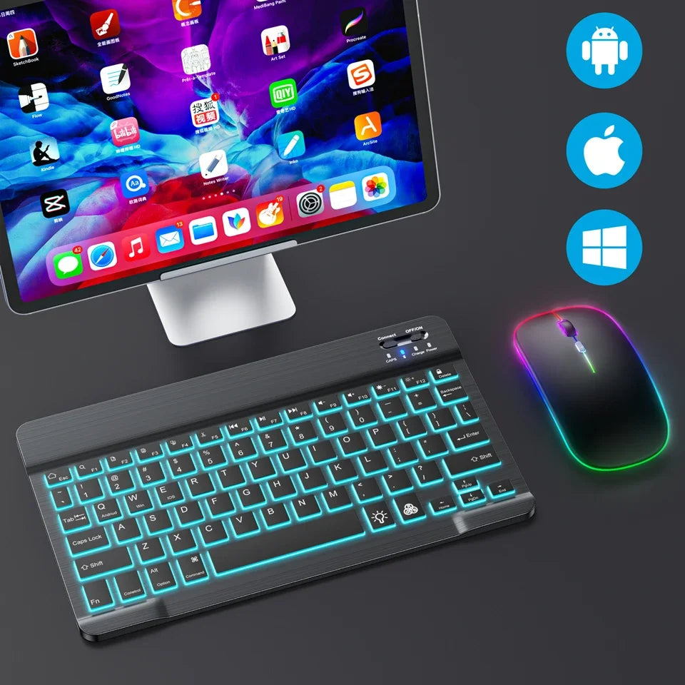 A portable Bluetooth keyboard and mouse set with backlit keys and a sleek design is shown next to a laptop.