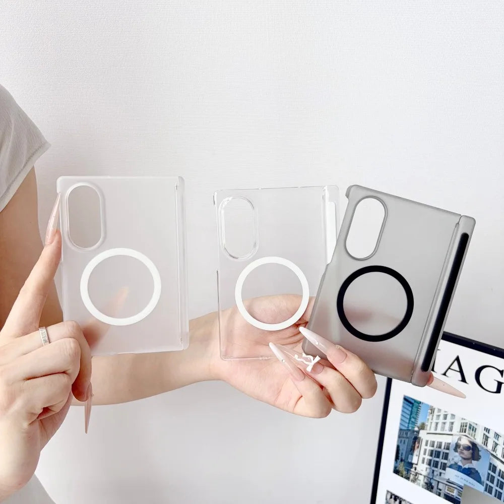 A hand holds a clear silicone case for a Samsung Galaxy Z Fold phone with a magnetic hinge protection feature.