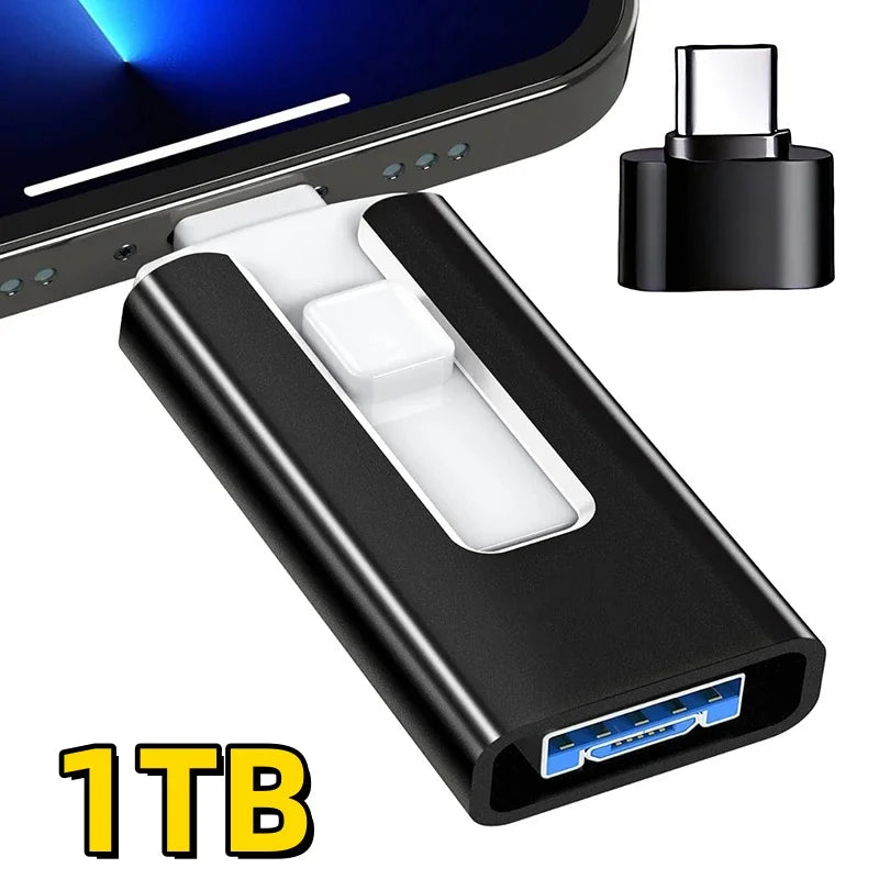 A black 1TB USB 3.0 flash drive with Lightning and Type-C connectors shown next to a smartphone.