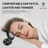 A woman is wearing a small, black ear patch while resting, with an open earbud visible nearby.