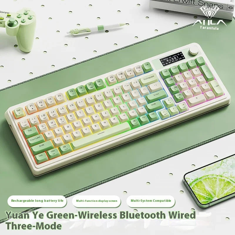 A white and green wireless Bluetooth wired three-mode keyboard with a lime green keycap shown on a desk.