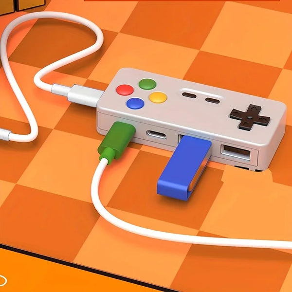 A beige 4-in-1 USB hub with Type-C ports and a white cable is shown on an orange checkered surface.