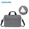A gray laptop and tablet messenger bag with a padded sleeve and adjustable strap.