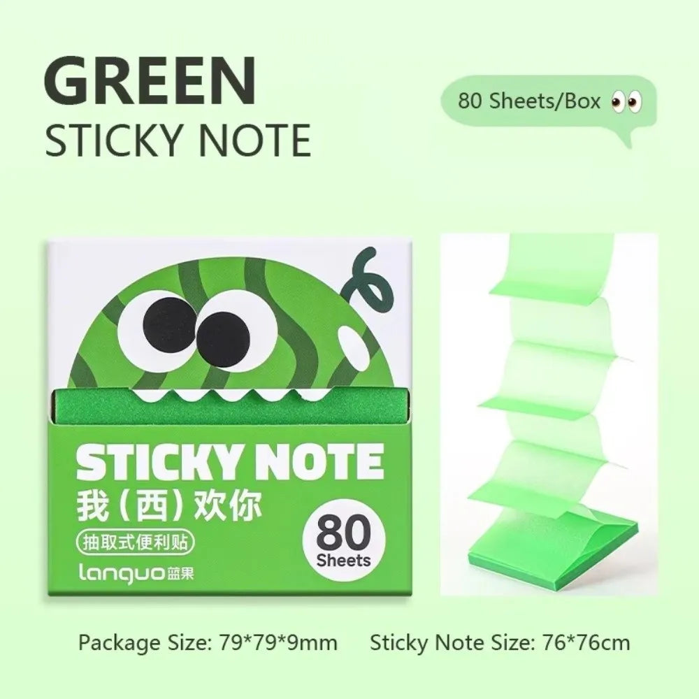 A box of green sticky notes featuring a cartoon fruit pear design and text.