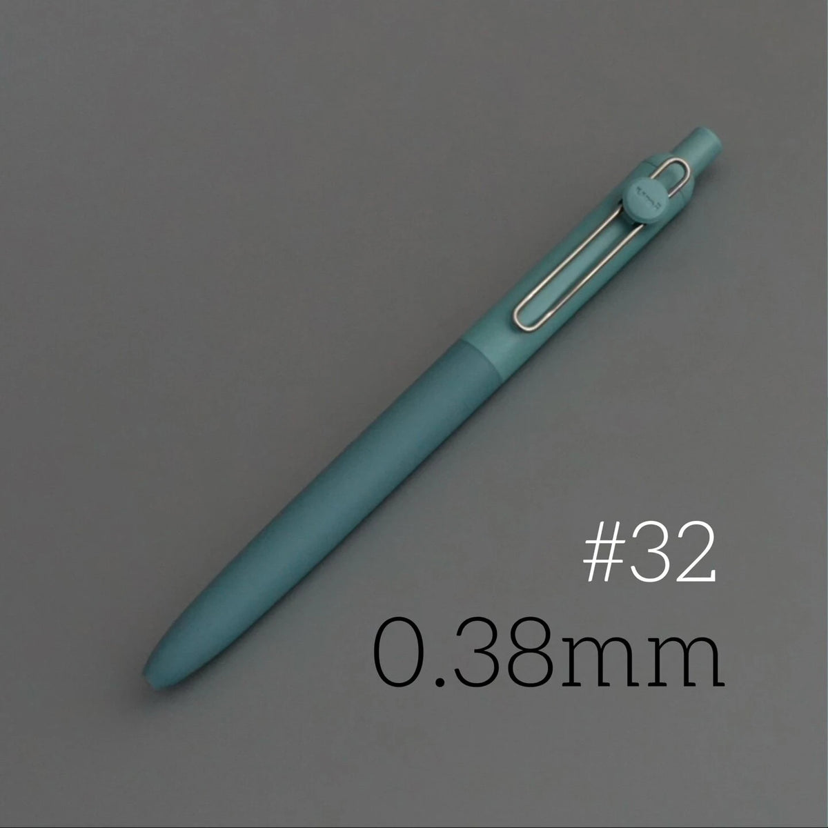 A teal precision gel pen with a silver tip and clip, shown diagonally on a gray background.