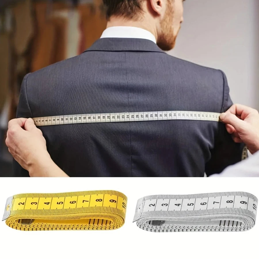 A man is measuring the waist of a suit jacket with two soft flexible measuring tapes, one yellow and one silver.