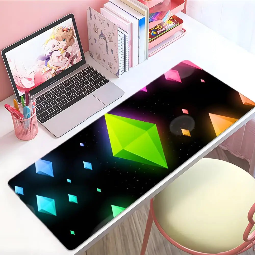 A large gaming mouse pad featuring a dark background with glowing green and blue geometric shapes on a white desk.