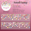 A display of small glass lamps hanging from a string, used as light surrounds for decoration.
