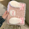 A pink fluffy rabbit plush case designed to hold an iPad, featuring white and pink accents.