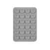 A gray plastic tray containing 24 silicone suction cups for mounting phones and tablets.