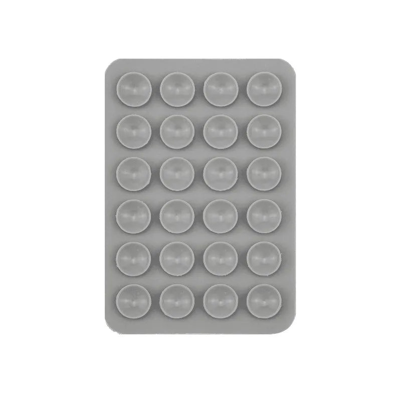 A gray plastic tray containing 24 silicone suction cups for mounting phones and tablets.