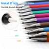 A collection of metal ST nib pens in various colors and angles resting on a white grid paper.
