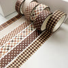 A set of six rolls of brown plaid washi tape featuring decorative grid and polka dot patterns for crafting.