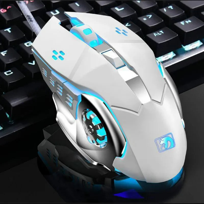 A white and blue computer mouse is shown resting on a black keyboard surface.