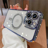 A hand holds a clear phone case decorated with glitter and diamonds, featuring multiple camera lenses.
