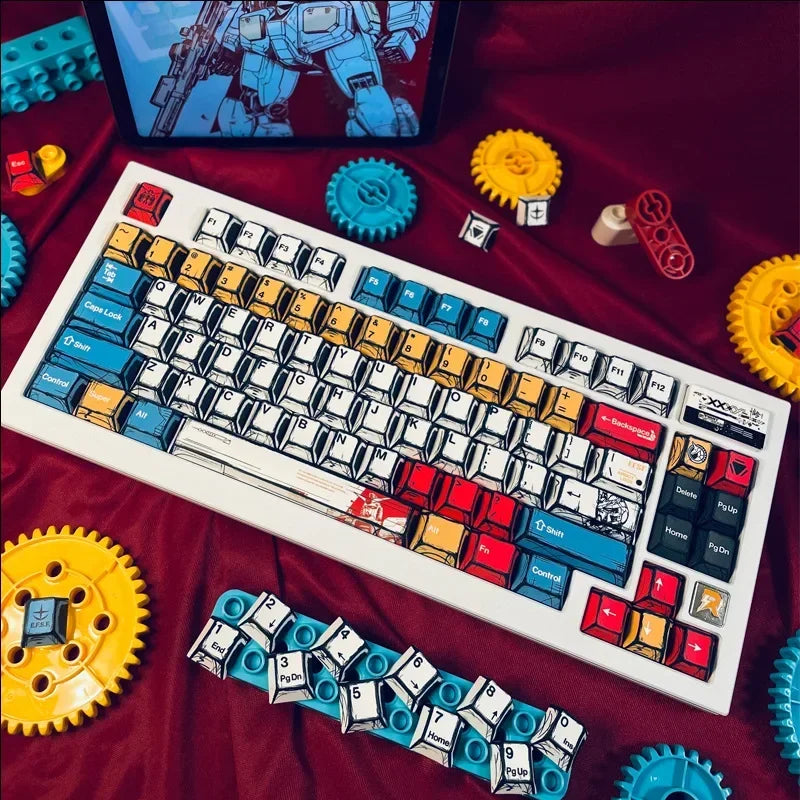 A custom cherry profile mechanical keyboard with blue keycaps and various yellow and blue mechanical parts is displayed on a 