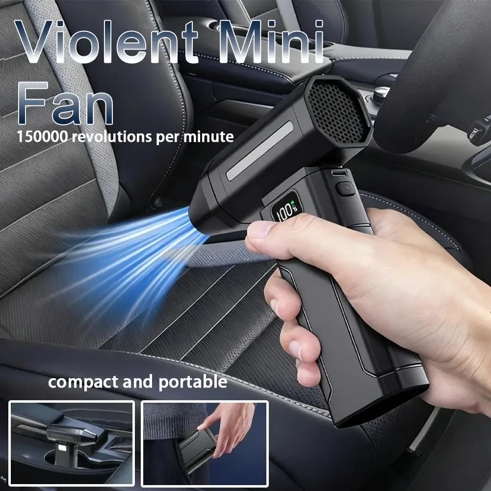 A hand is using a black violent mini fan air blower on a car seat fabric.