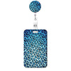 A blue leopard print retractable badge holder with a circular top.