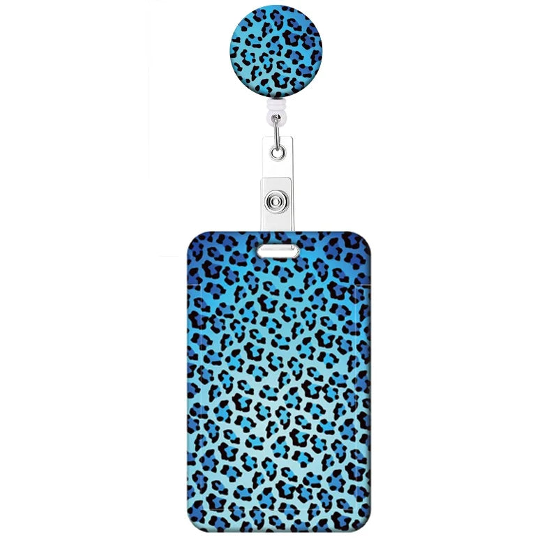 A blue leopard print retractable badge holder with a circular top.