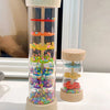 A wooden rain sound tube musical instrument filled with colorful plastic beads and tubes.