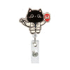 A black cat charm featuring a heart-shaped badge with a red border and a silver retractable badge reel.