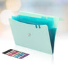 A light blue A4 accordion file organizer with a teal cover and elastic closure, next to a color palette.