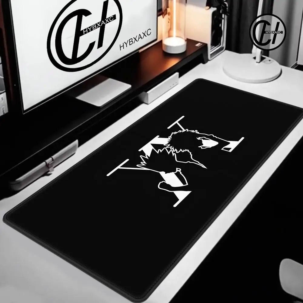 A black extra large gaming mouse pad featuring a white silhouette of a wolf head and paws, displayed on a desk.