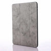 A gray retro marbling skin for an iPad Pro shown from the side.