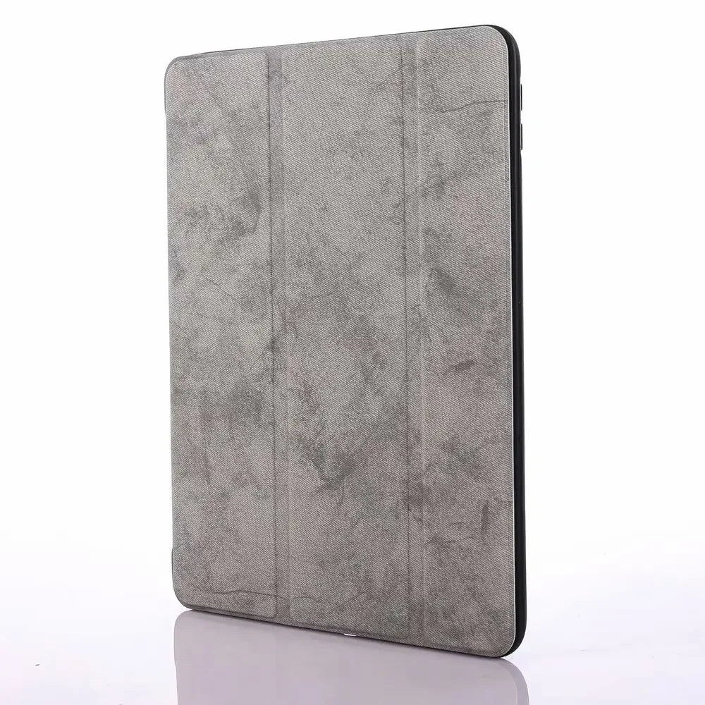 A gray retro marbling skin for an iPad Pro shown from the side.