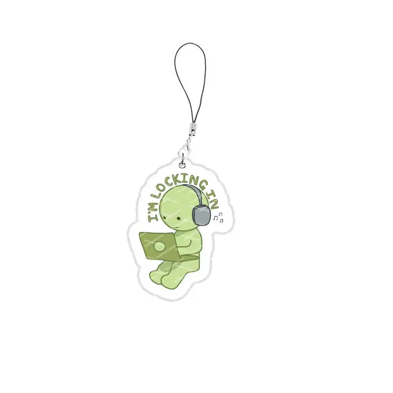 A green, Smiski-inspired acrylic phone charm keychain with a silver chain.