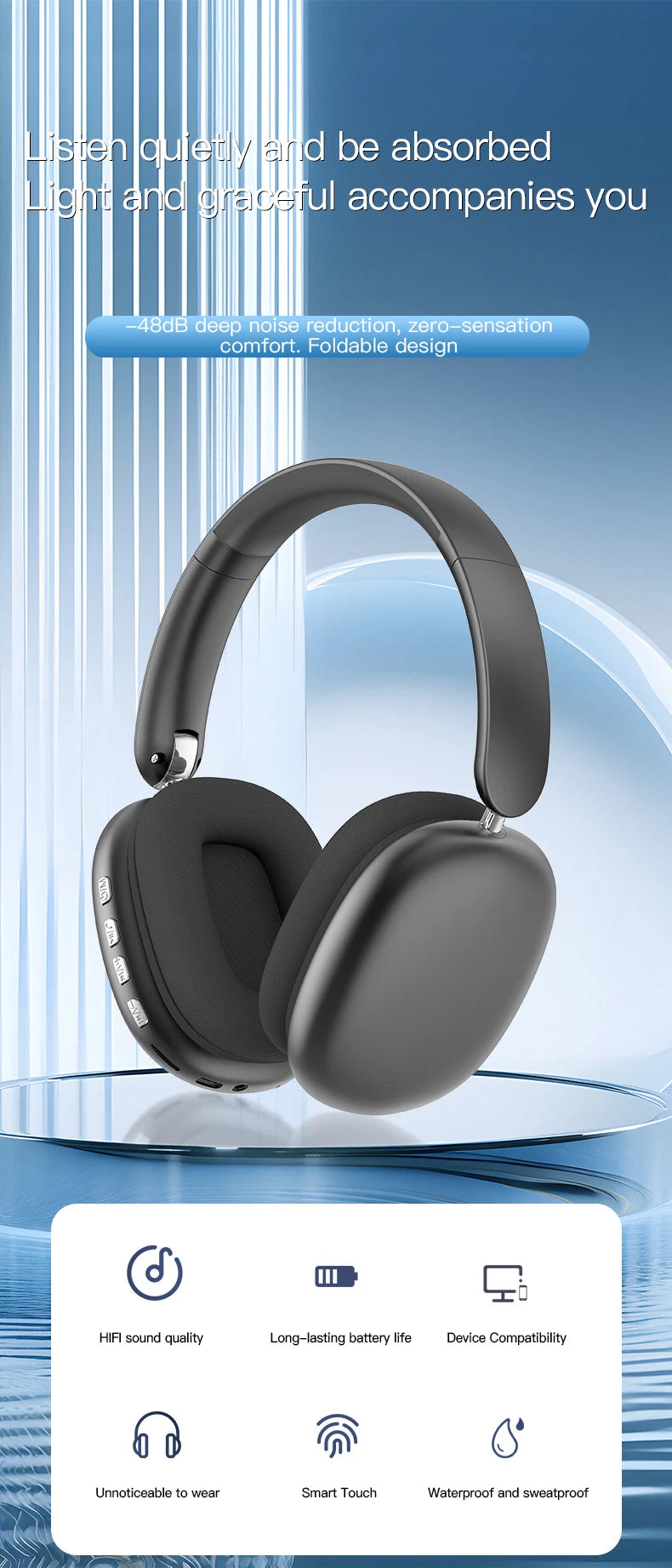 A pair of matte gray wireless over-ear headphones resting on a glass surface.