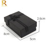 A black jewelry gift box with a velvet interior, shown from the top view.