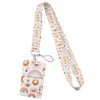 A white and orange patterned fabric lanyard with a clip and a decorative tag.