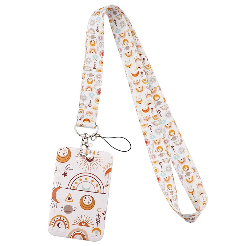 A white and orange patterned fabric lanyard with a clip and a decorative tag.