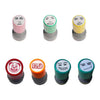 A set of five self-inking rubber stamps featuring various funny meme faces in pink, green, yellow, red, and dark green.
