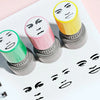 A collection of self-inking rubber stamps featuring various funny meme faces in yellow, pink, and green.
