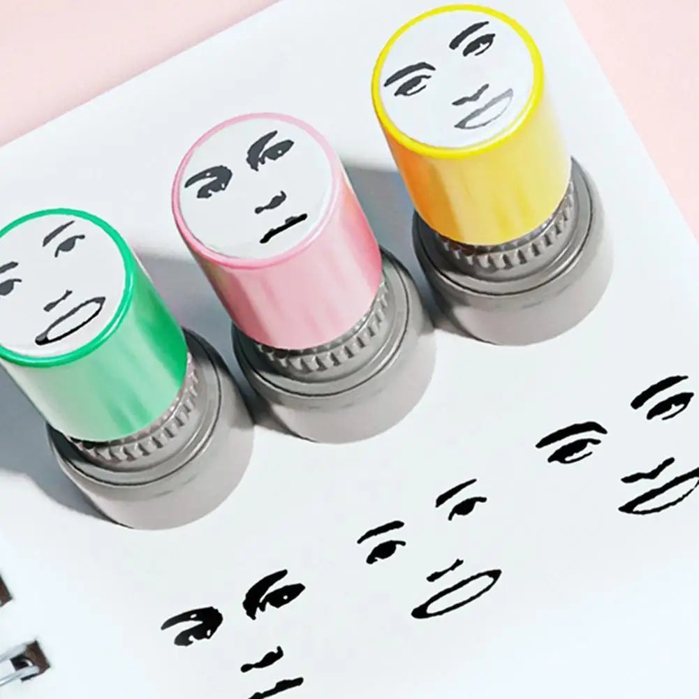 A collection of self-inking rubber stamps featuring various funny meme faces in yellow, pink, and green.