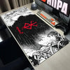 A large black and white anime design mouse pad featuring a fierce character and a red cross symbol for gaming.