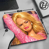 A pink glitter doll face mouse pad featuring a blonde woman and a black gaming mouse.